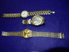 A John Paul Suchel quartz Wristwatch with pale gold coloured face having baton markers and