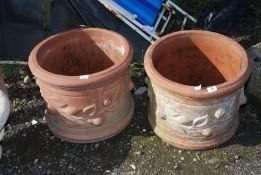 Two round terracotta planters with branch decoration, 19 1/2'' x 15 1/2''.