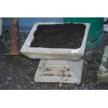 A square concrete planter 24'' x 12'' high.