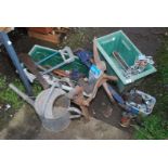 Two plastic containers, Stilsons, blow lamp, clamp on vice, galvanised watering can, etc.