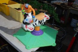 A child's Fisher Price play along Bucking Bronco.