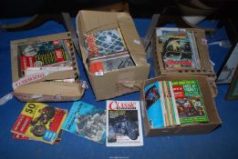 Four boxes of motorcycle magazines.