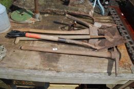An axe, shovel and fork heads, etc.