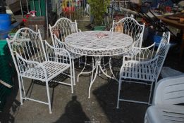 A white painted metal table (37 1/2" diameter x 29 1/2" high) with four matching chairs.