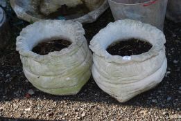 Two sack shaped concrete planters, 10'' high.