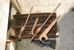 A steel box and contents including large Stilsons, spanners, car jack, wheel spanner, etc.