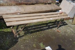A metal and wood collapsible bench, 71'' long x 20'' high.