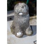 A concrete Old English Sheepdog figure.