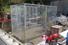 A metal Dog Run, the two sides being made up of four sections,