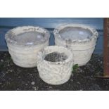 Three painted concrete planters, two @ 15'' x 11'' high and one @ 11 1/2'' x 9 1/2'' high.