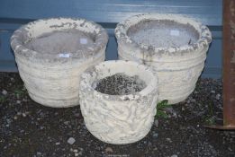 Three painted concrete planters, two @ 15'' x 11'' high and one @ 11 1/2'' x 9 1/2'' high.