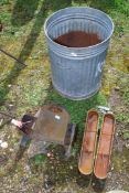 A cast iron fire back, galvanised dustbin (with hole) and two cast iron troughs 20'' x 4''.