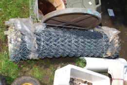 A roll of chain link wire, 48'' high.