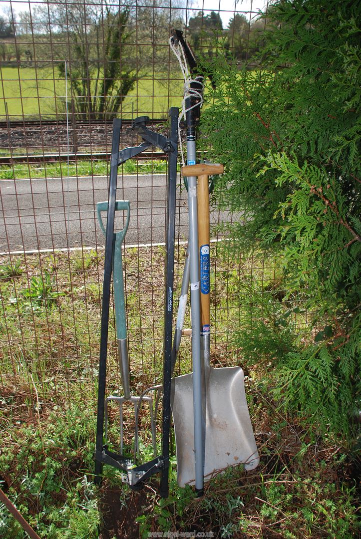 An Aluminium shovel and fork, pruner, roof bars and another fork.