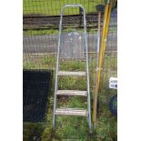 A wooden and Aluminium four rung stepladder.