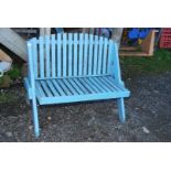 A blue painted bench, 45'' long x 36'' high x 19'' seat height.