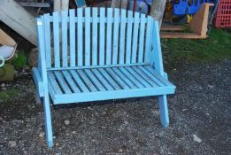 A blue painted bench, 45'' long x 36'' high x 19'' seat height.