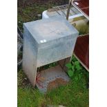 A rat proof automatic chicken feeder, 13'' high x 9 1/2'' x 19'' high.