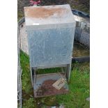 A rat proof automatic chicken feeder, 13'' x 9 1/2'' x 25'' high.