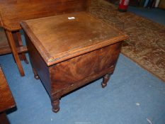 A Mahogany and other woods Box Commode standing on turned legs (unfurnished),