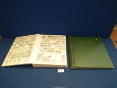 A blue Stanley Gibbons album and contents including stamps from the Olympic Games of various years,