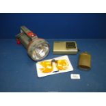 A 6 volt plastic Torch (no battery), a compact Bell & Howell fm/mw/sw nine band World Receiver,