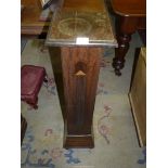 A square Oak Pedestal having reeded and inlaid detail, 36 3/4'' high,