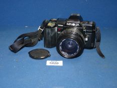 A Minolta 7000 SLR camera with a Sigma Zoom Master 35-70mm.