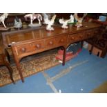 A mid Oak Welsh Dresser Base having four frieze drawers having contrasting banding and turned