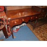 A circa 1900 cross banded topped Mahogany Lowboy/Writing Table having three frieze drawers with