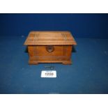 A small Money box, 5'' wide x 2 3/4'' x 3 1/2'' deep, with key.