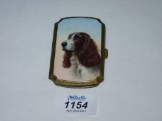 A gilt metal Card Case having an enamel top depicting a hand painted portrait of an English Spaniel,
