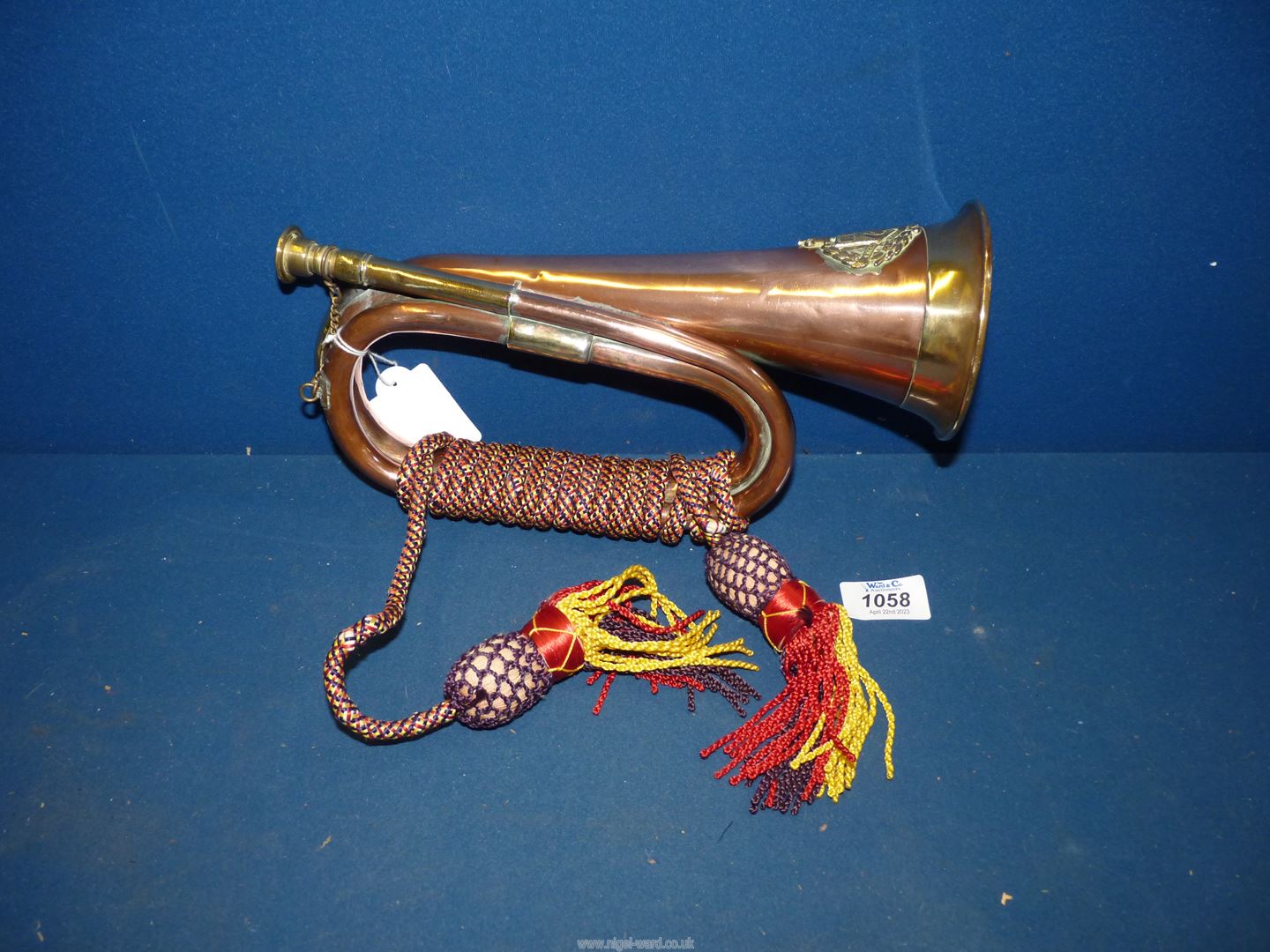 An early 20th century Australian University of Perth copper and brass Bugle having a brass Coat of