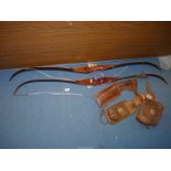 Two Centaur recurve Archery bows and two leather quiver holders with pouch attached to belt,