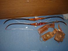 Two Centaur recurve Archery bows and two leather quiver holders with pouch attached to belt,