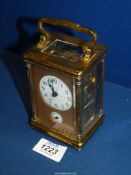 A French made Brass and bevelled glass cased Carriage Clock having an alarm movement,