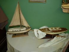 Two models of Sailing yachts, both mounted on wooden plinths, one a/f.
