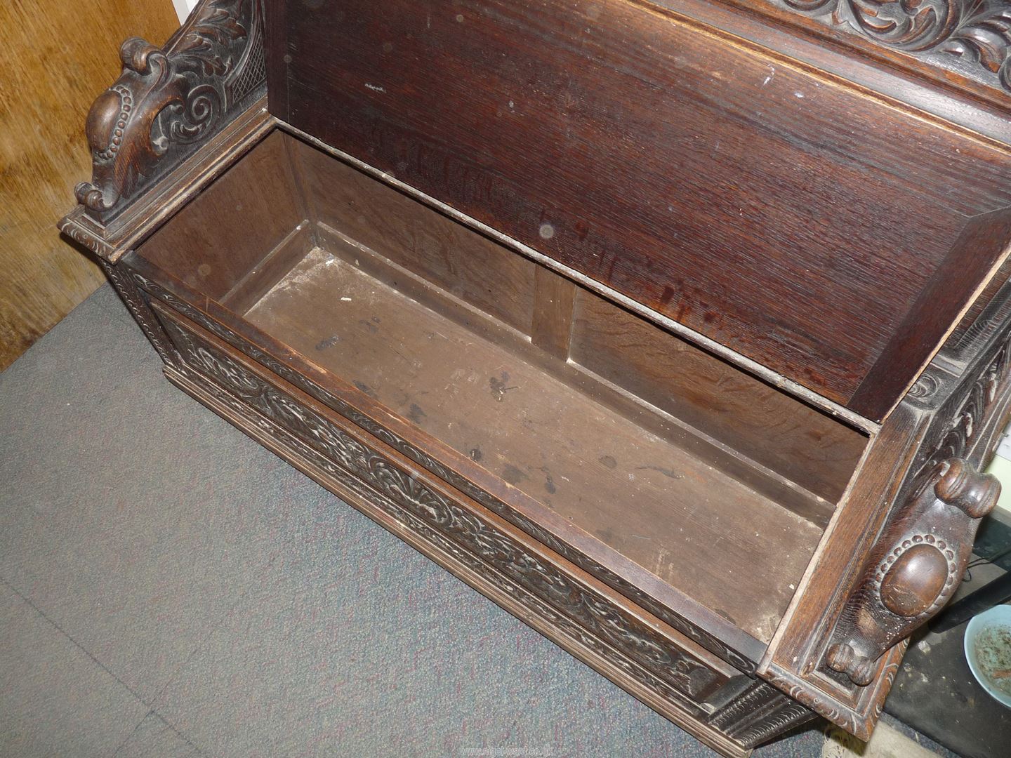 A profusely carved Oak Hall locker base Settle, the backrest with depictions of Phoenixes, - Image 3 of 9