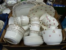 A Cauldon part tea set, white with pink roses including three cups and five saucers,
