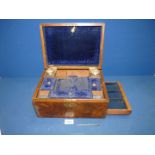 A Walnut vanity/writing Box, with blue velvet lined interior, two perfume bottles (one badly a/f),