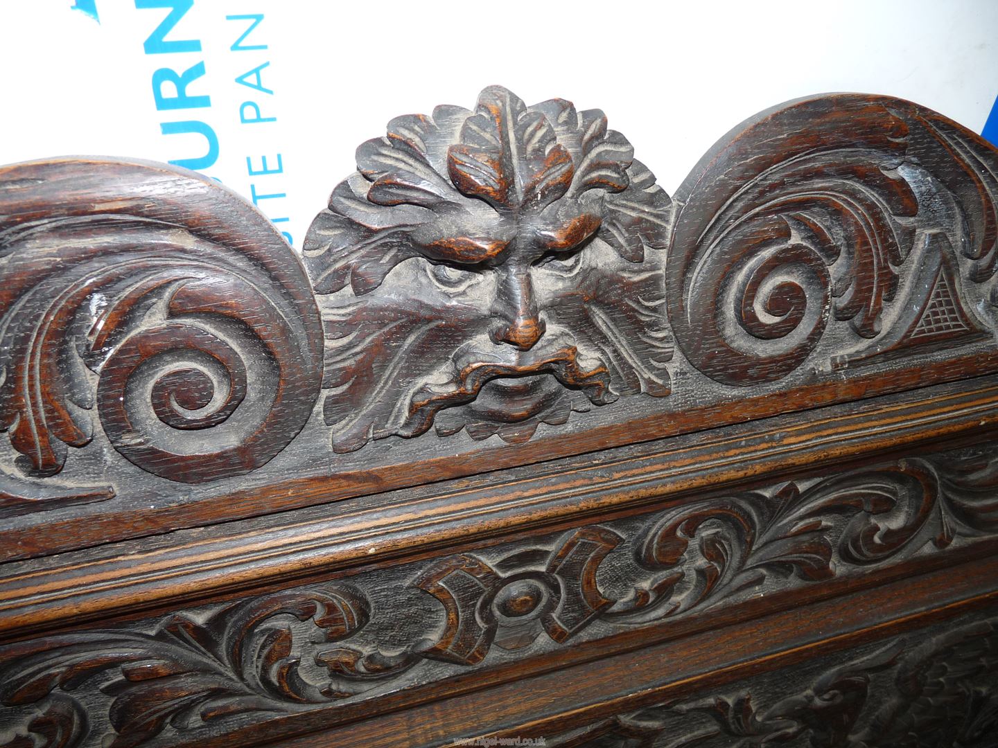 A profusely carved Oak Hall locker base Settle, the backrest with depictions of Phoenixes, - Image 4 of 9