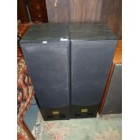 A pair of black Ash cased Tower Speakers by Acoustic Reference, model SM-1000.