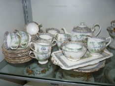 A Royal Albert Silver Birch twelve piece tea set to include teapot, twelve cups and saucers,