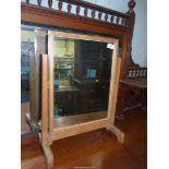 A limed Oak Dressing table mirror with ivorine batton to underside marked Heals,