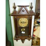 A compact darkwood cased Wall Clock, having a two-train spring driven movement,