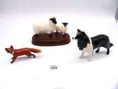 A Beswick ewe with lamb on plinth, Beswick fox and unmarked sheepdog.