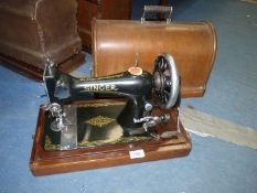 A Singer hand sewing machine in case, model no. 8614639.