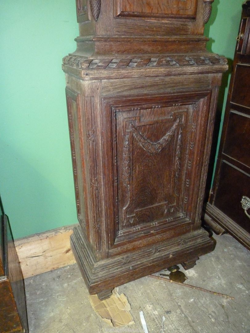 An unusually slender Oak cased long-case Clock, the case decorated in relief with bows and swags, - Image 6 of 7