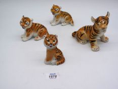 Four Lomonsov USSR Tigers, all sitting, good condition.