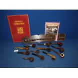 A pack containing eight vintage briar pipes, one a novelty bull,
